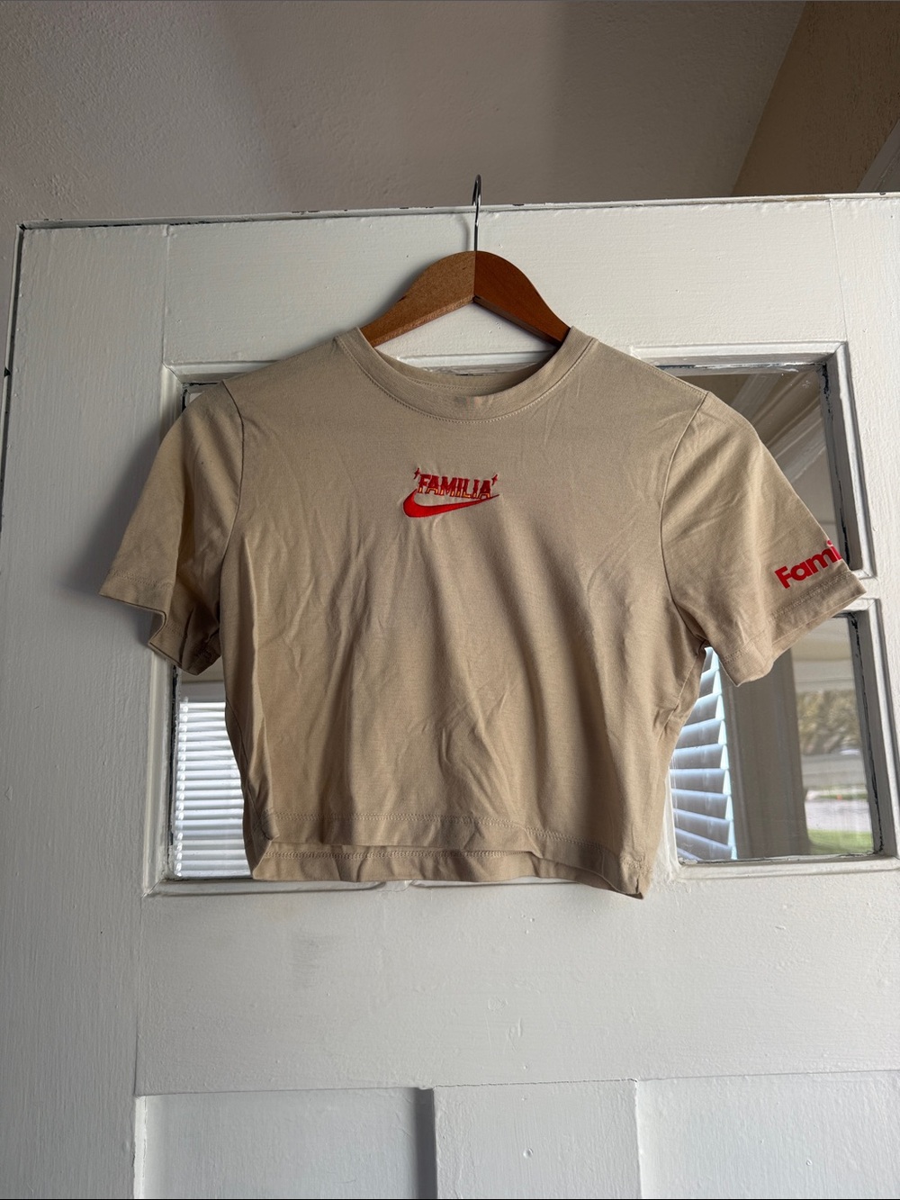 Nike Short Sleeve Crop Tee in Beige with Red Logo